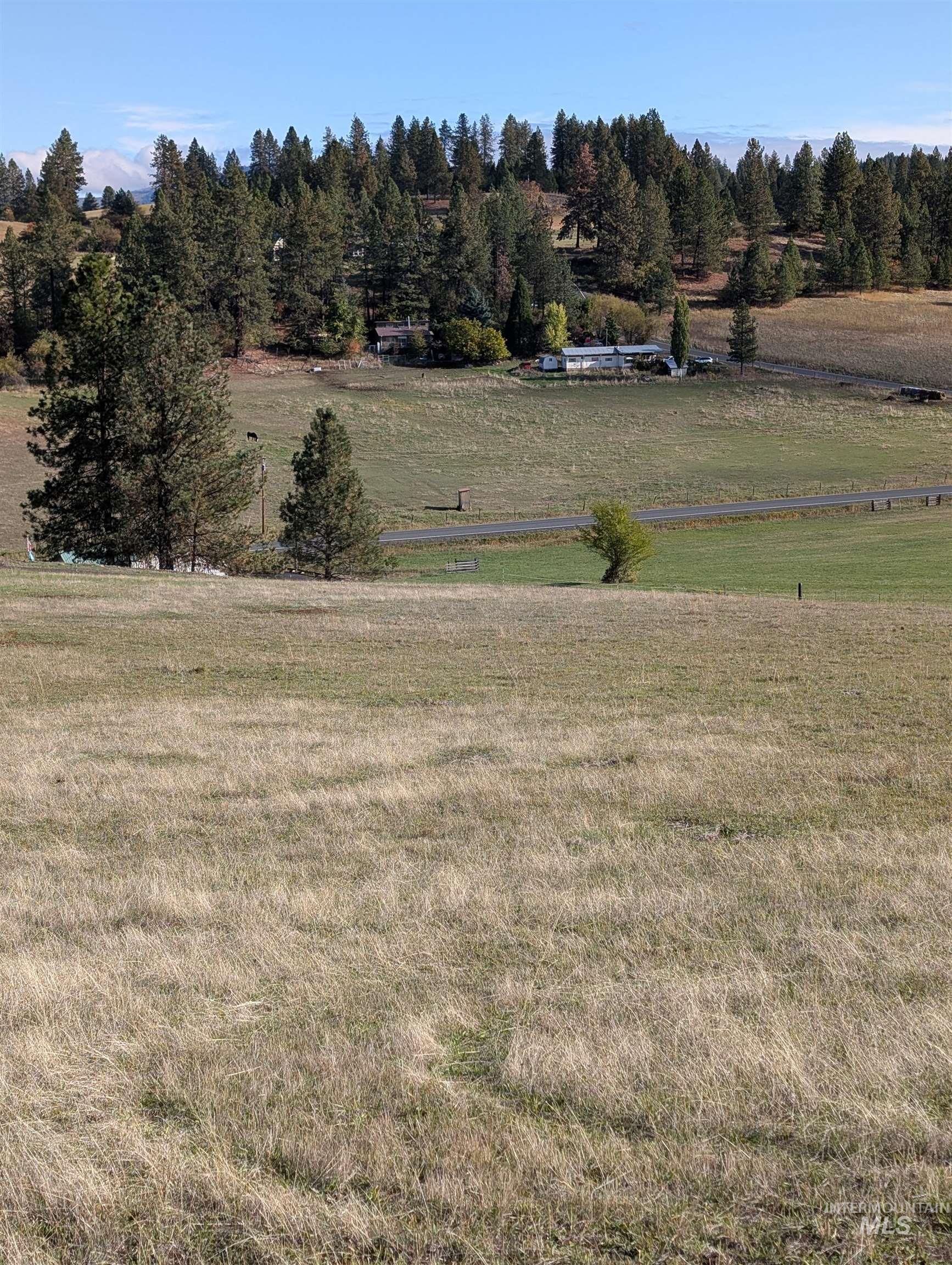 View of grassy yard with a view of countryside