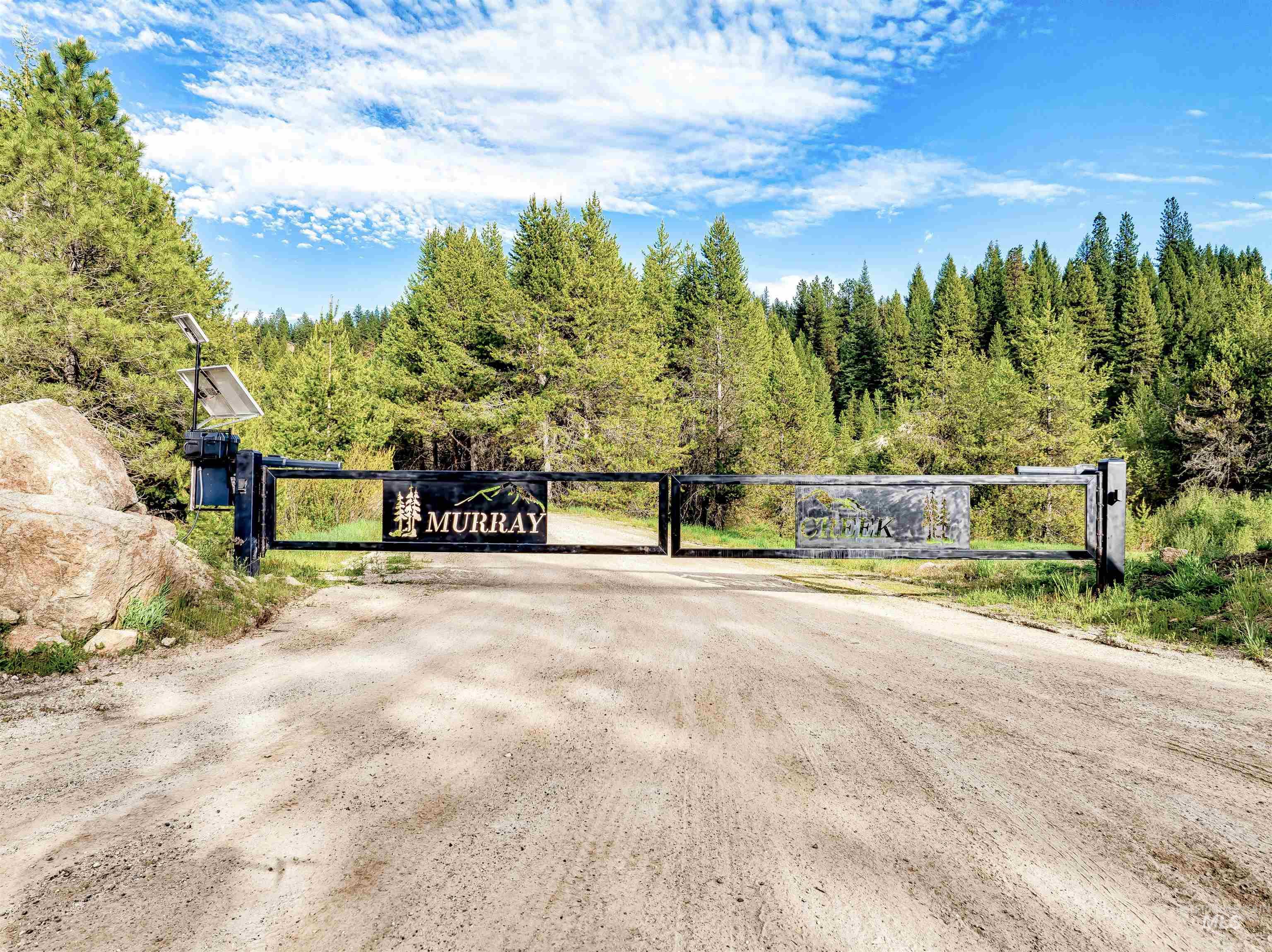 Gate featuring a view of trees