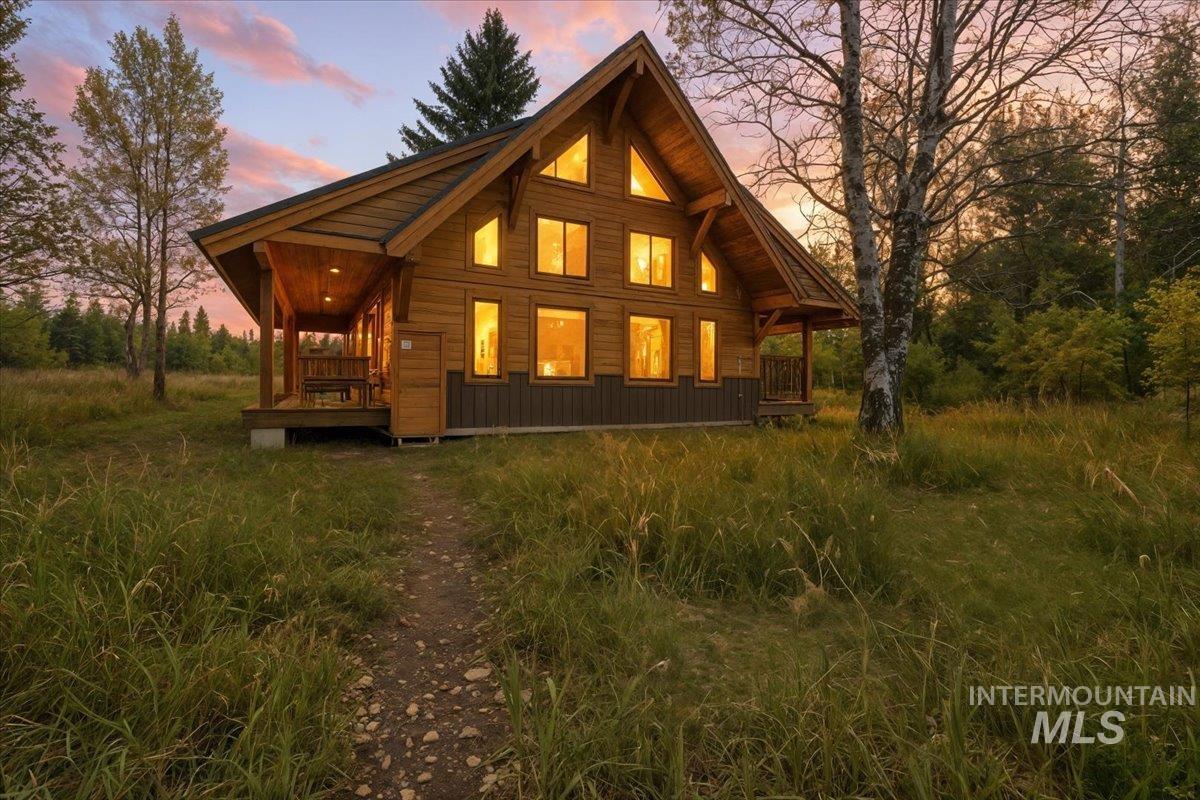 View of back of house at dusk