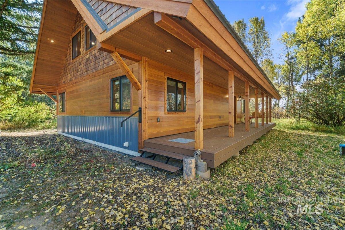 View of side of home with covered porch