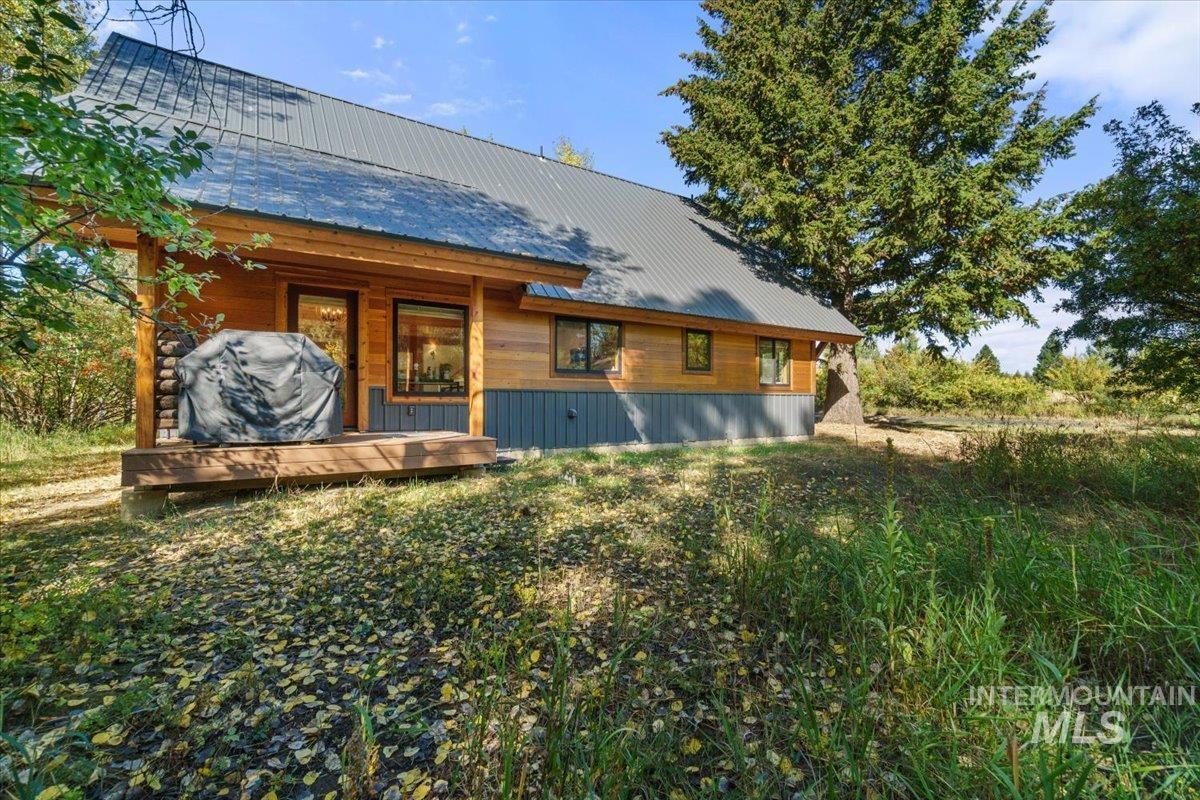 Rear view of house with a metal roof
