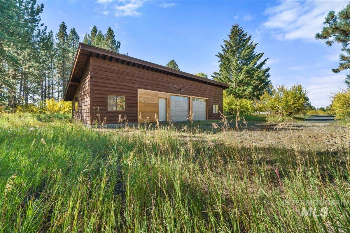View of outdoor structure with a garage