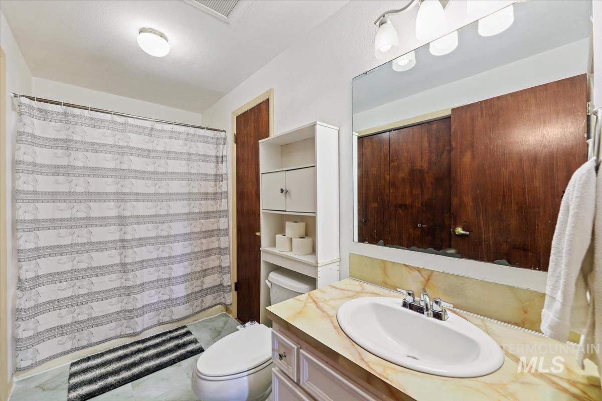 Bathroom featuring vanity and a shower with curtain
