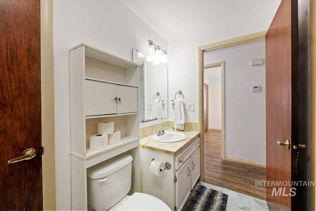 Bathroom with vanity and light wood-style flooring