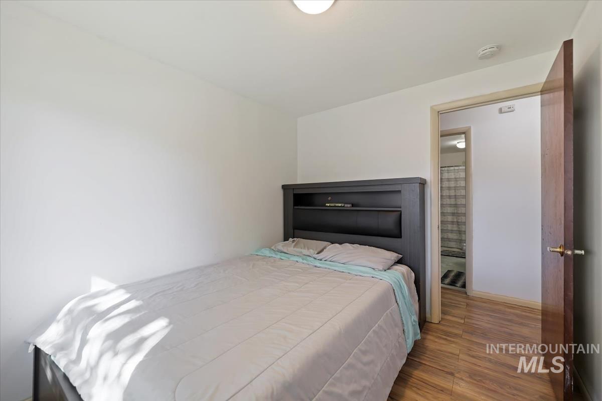 Bedroom with wood finished floors