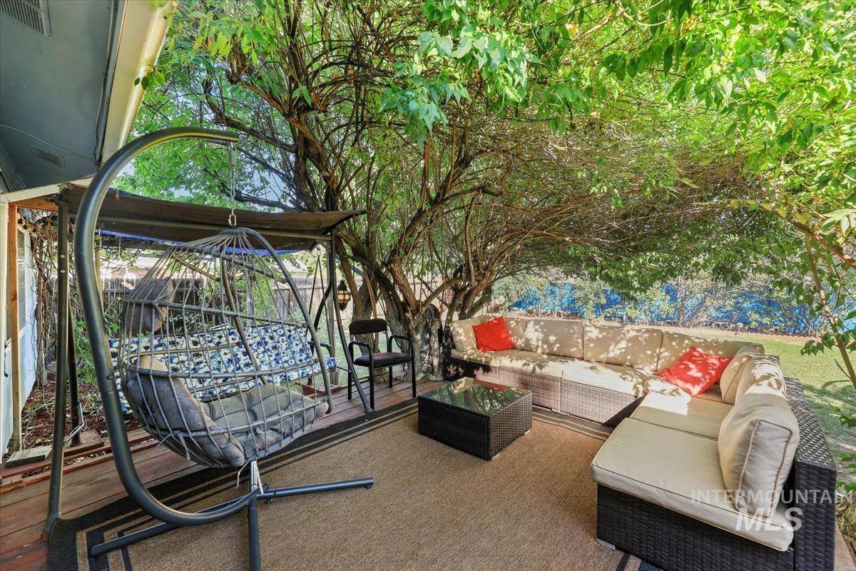 View of patio with an outdoor hangout area