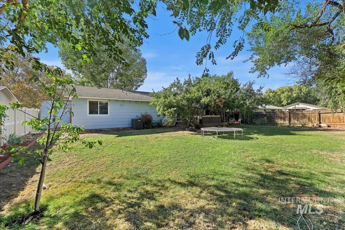 Fenced backyard with a patio area