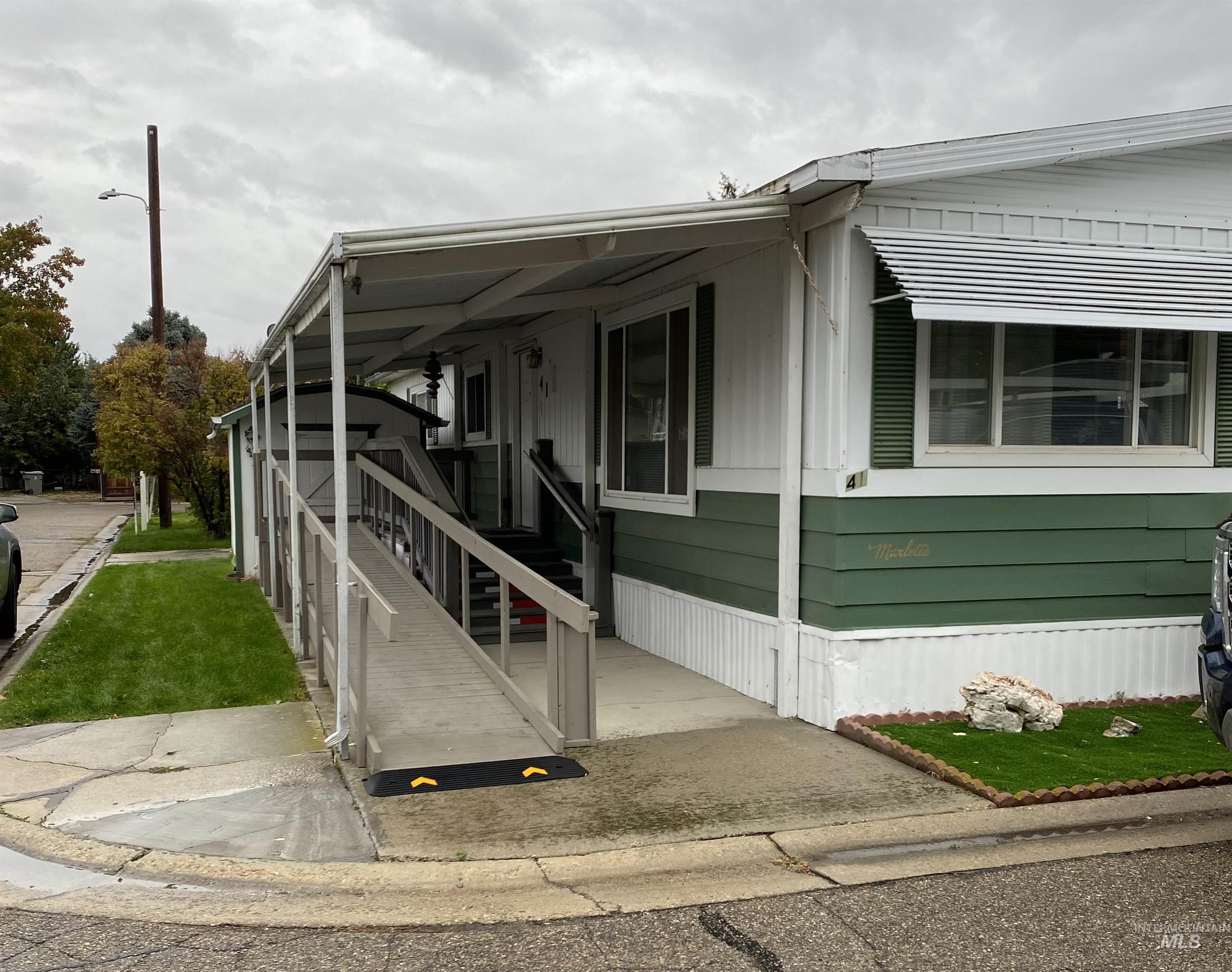 View of side of home with covered porch