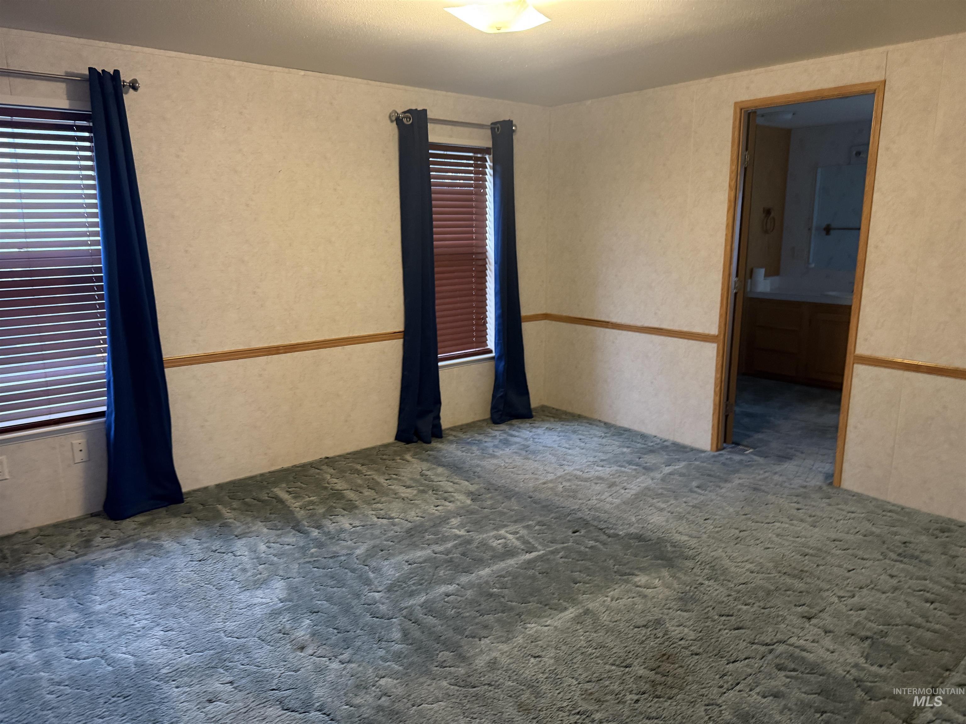 View of carpeted spare room