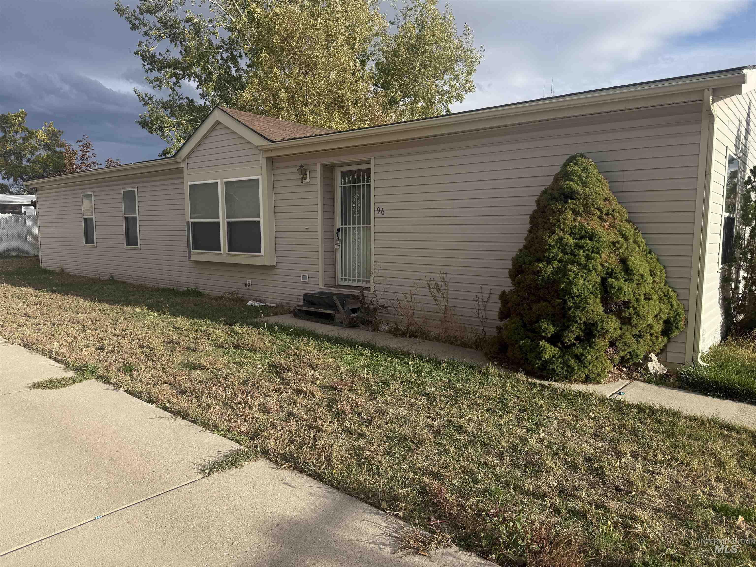 View of front of house featuring a front yard and entry steps