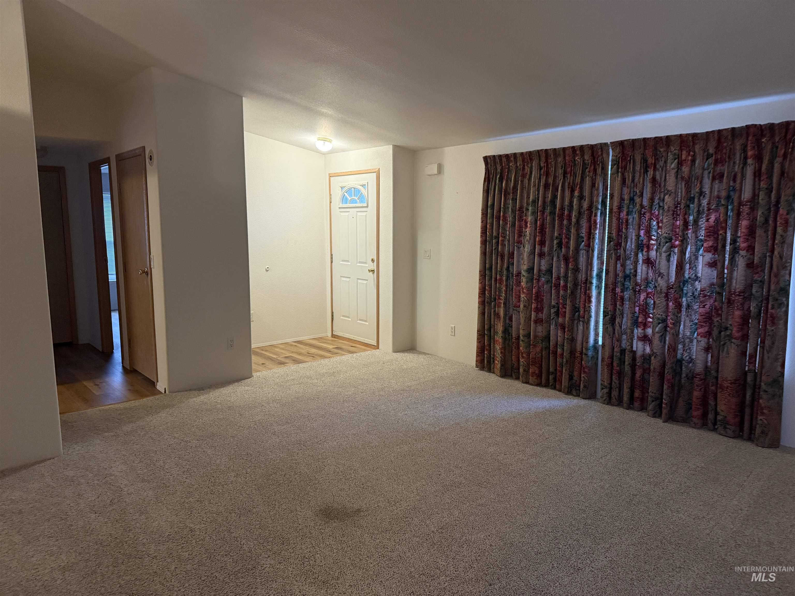 Unfurnished room featuring carpet floors