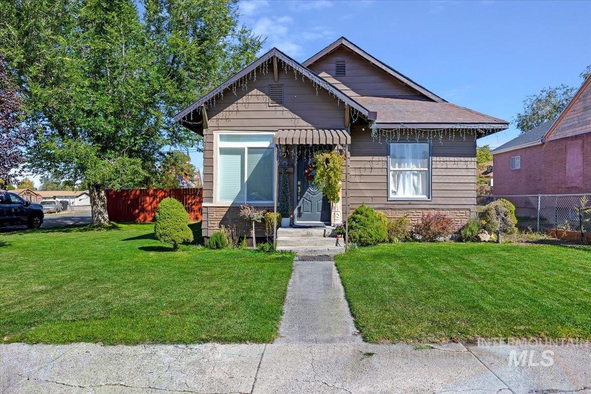 Bungalow-style house featuring stone siding