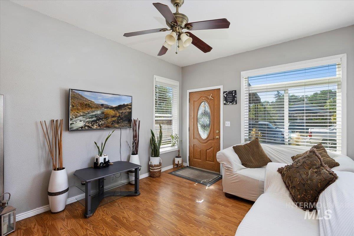 Foyer featuring wood finished floors and a ceiling fan