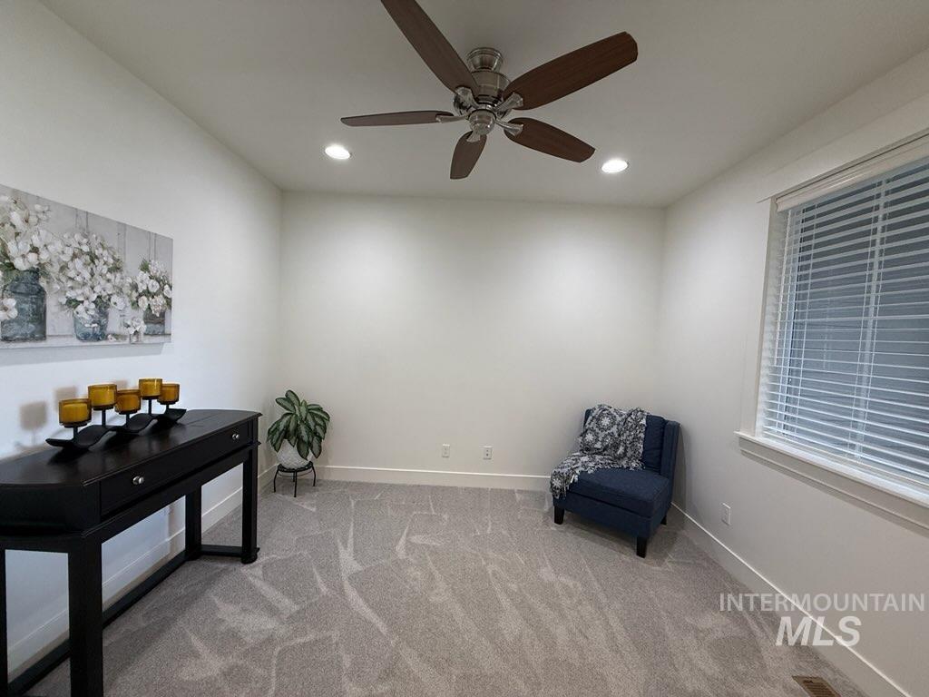 Unfurnished room with light colored carpet, recessed lighting, and ceiling fan