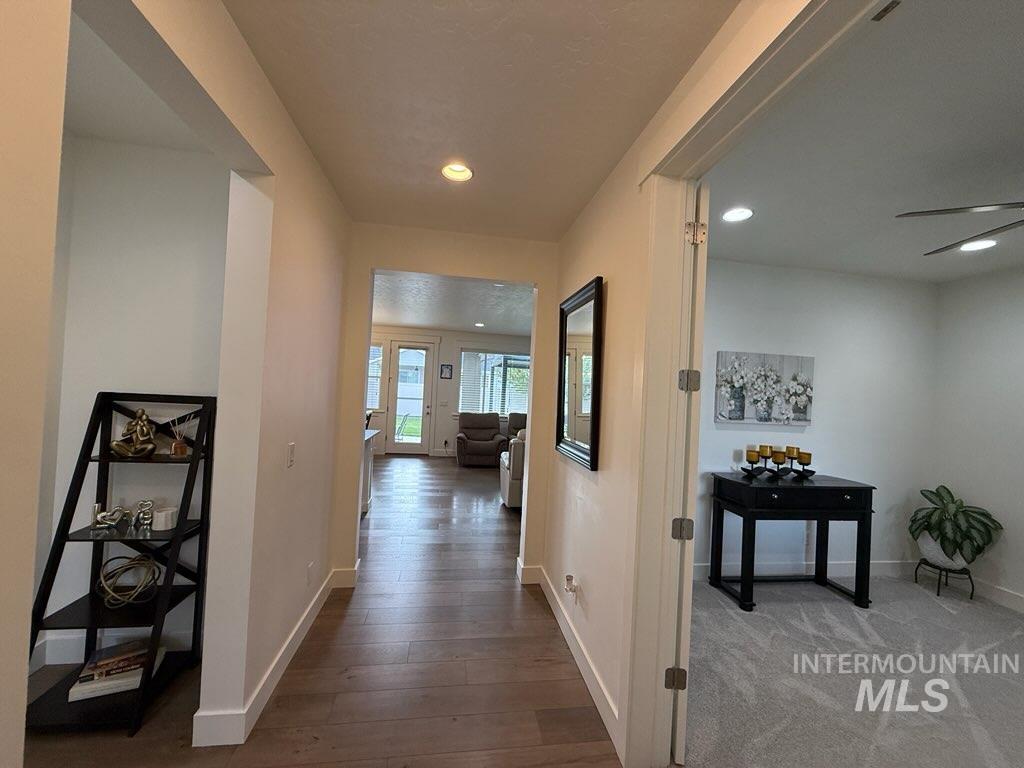 Corridor featuring recessed lighting and light wood-style floors