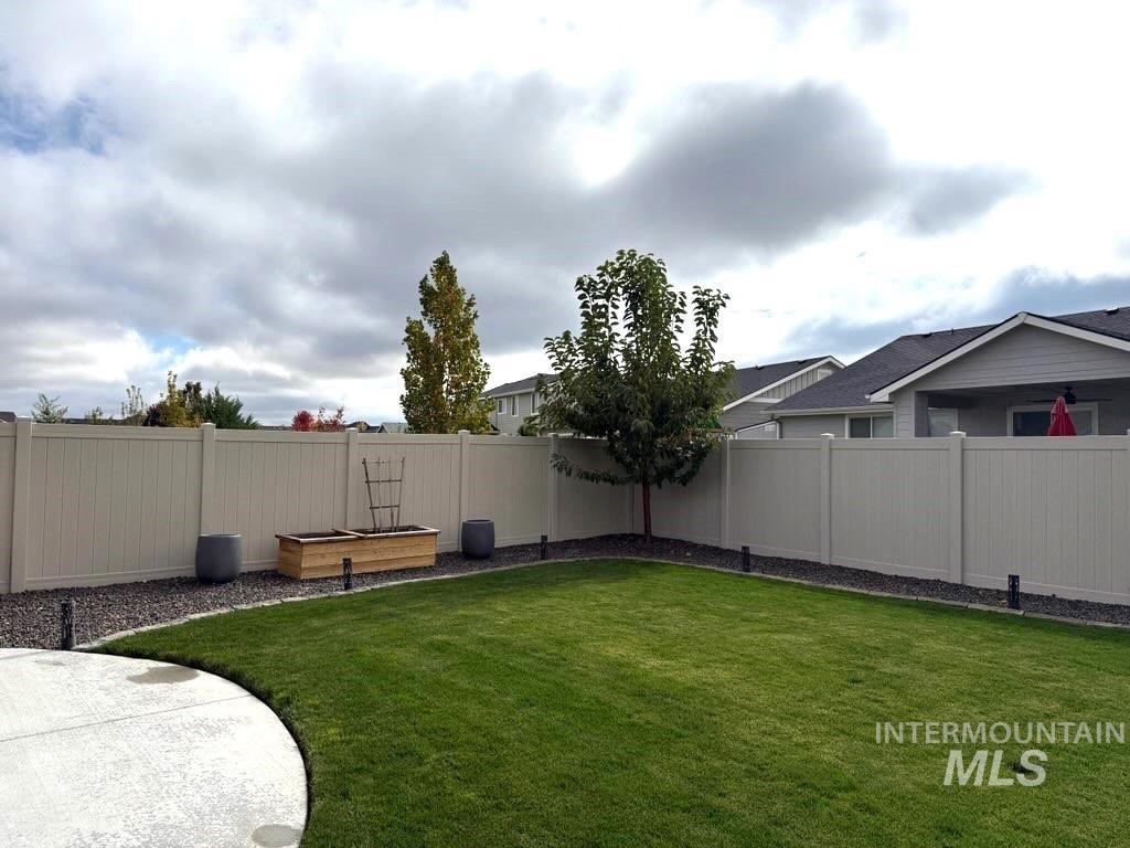 View of fenced backyard