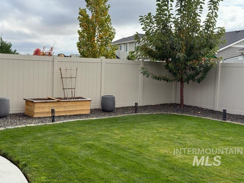 View of fenced backyard