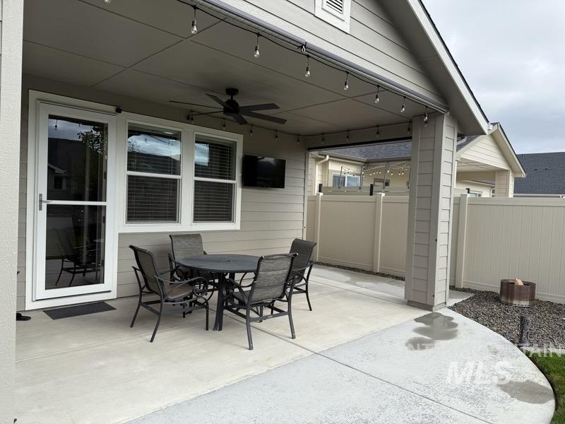 View of patio featuring ceiling fan and outdoor dining area