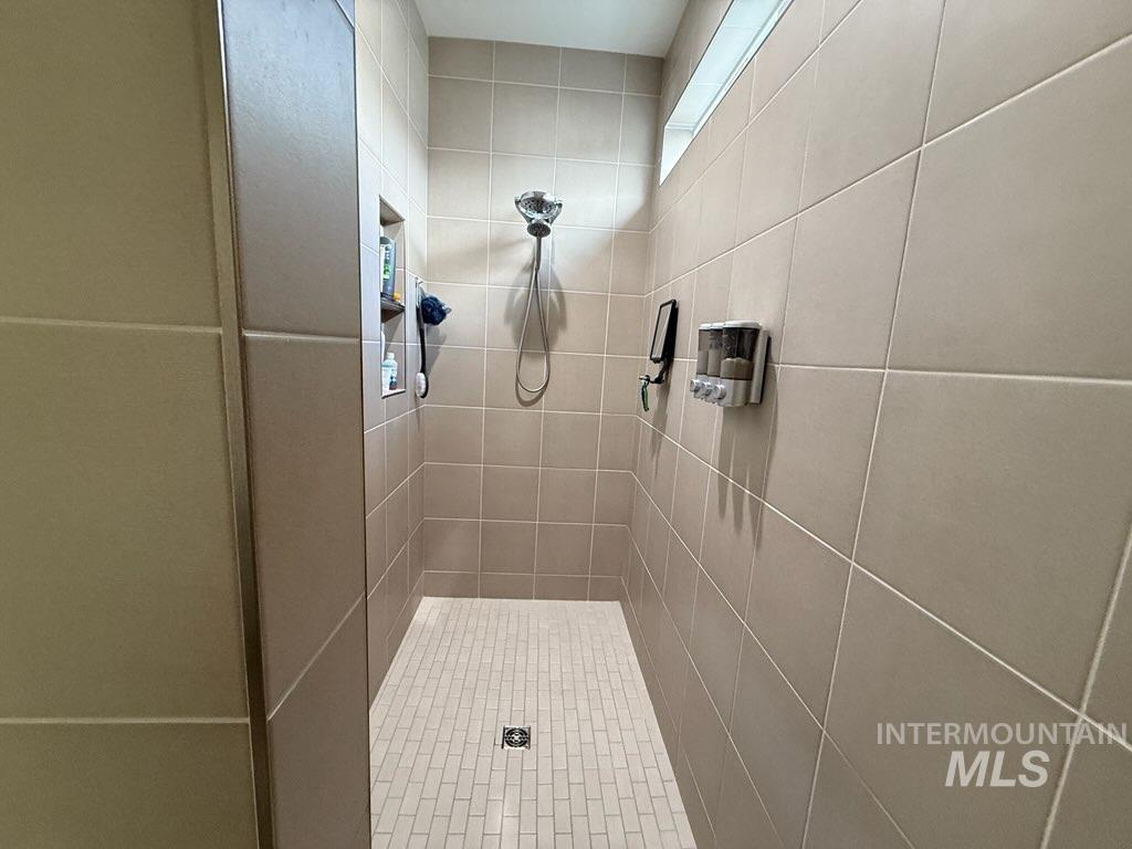 Bathroom with tiled shower
