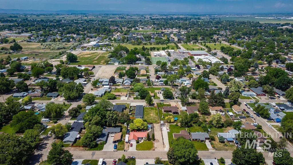 Aerial view of property's location with nearby suburban area