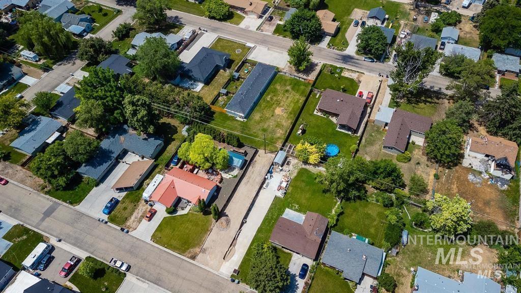 Aerial view of property's location with nearby suburban area