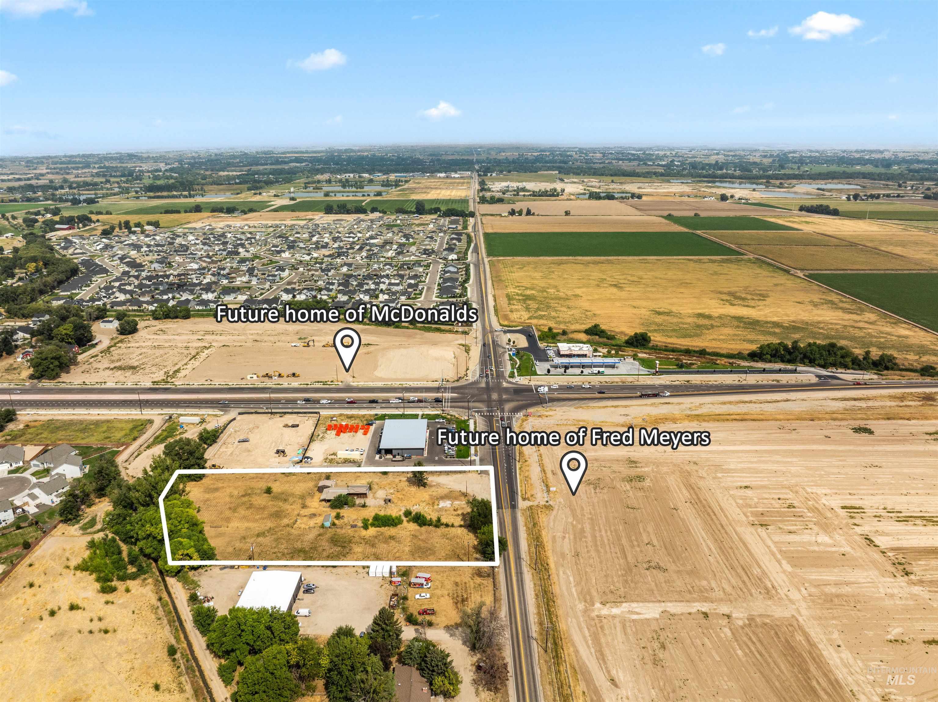 Aerial overview of property's location with property parcel outlined