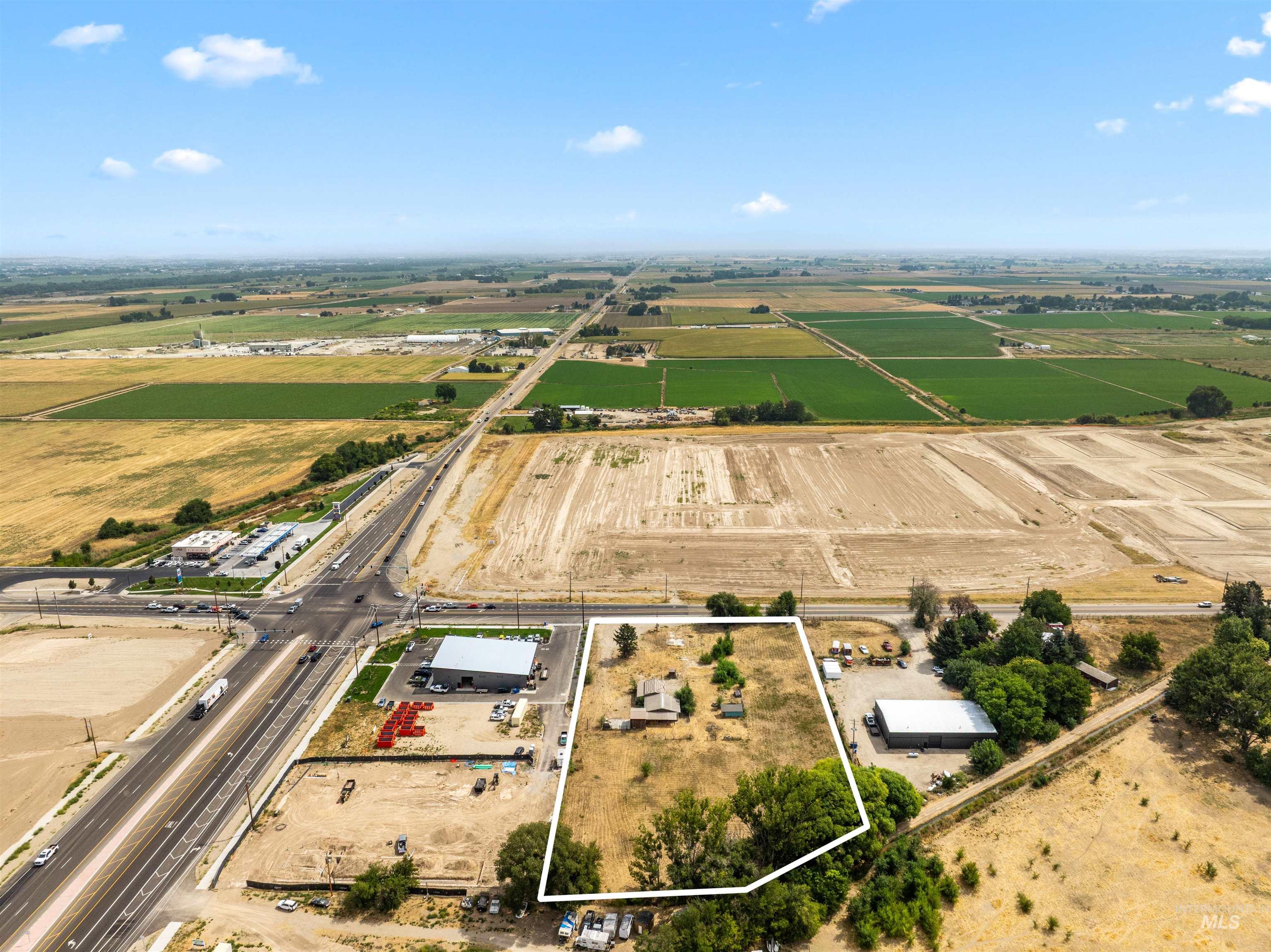 Aerial view of sparsely populated area featuring property boundaries highlighted
