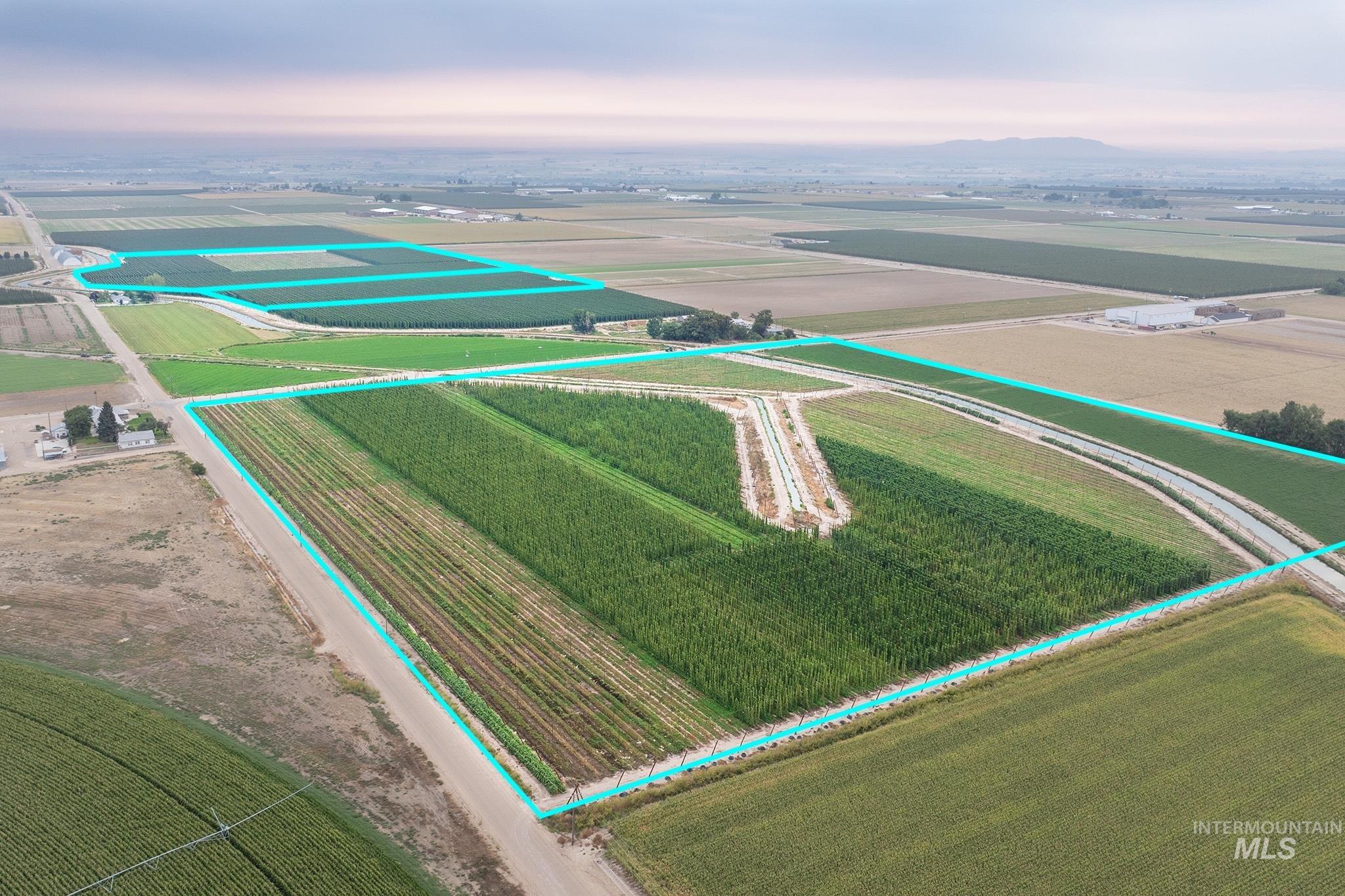 View of rural area featuring large plots for crops and property parcel outlined