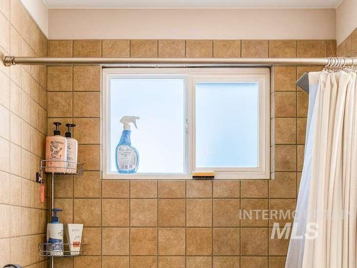 Bathroom view of a tile shower