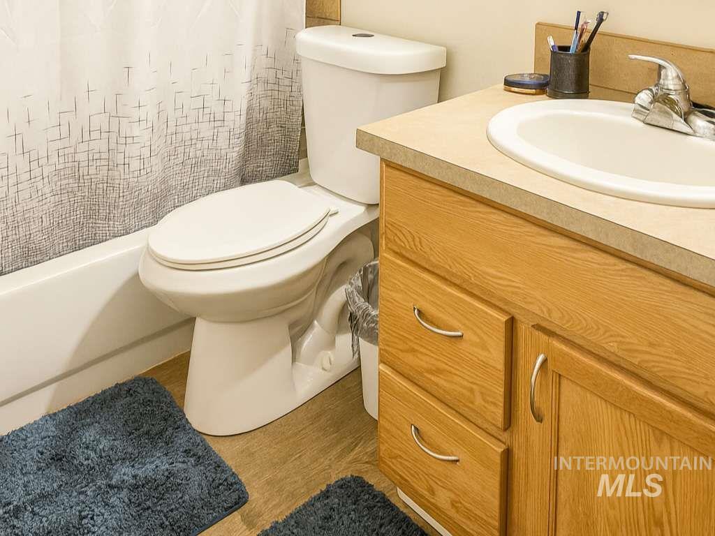 Bathroom with vanity and light wood-type flooring