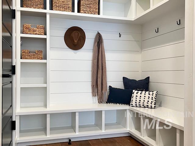 Mudroom featuring dark wood-style floors