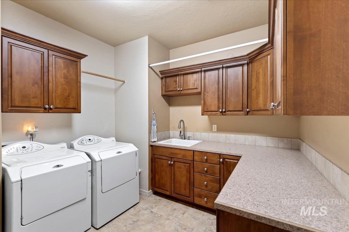 Laundry room featuring cabinet space and washer and dryer