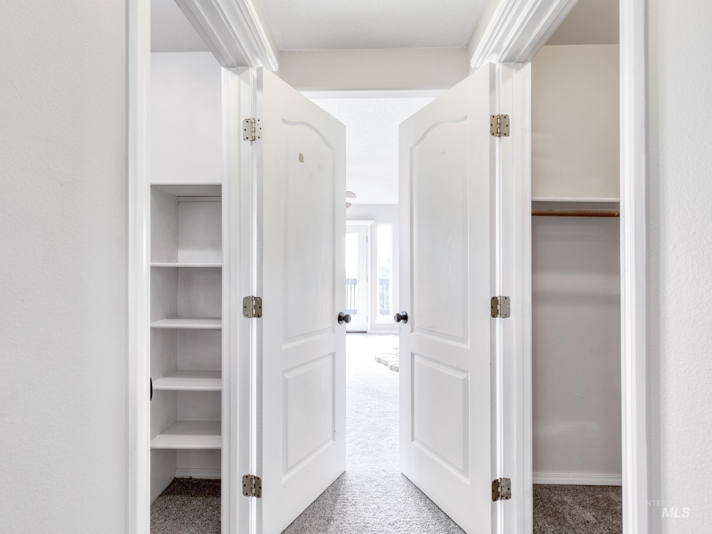 Hallway with light colored carpet