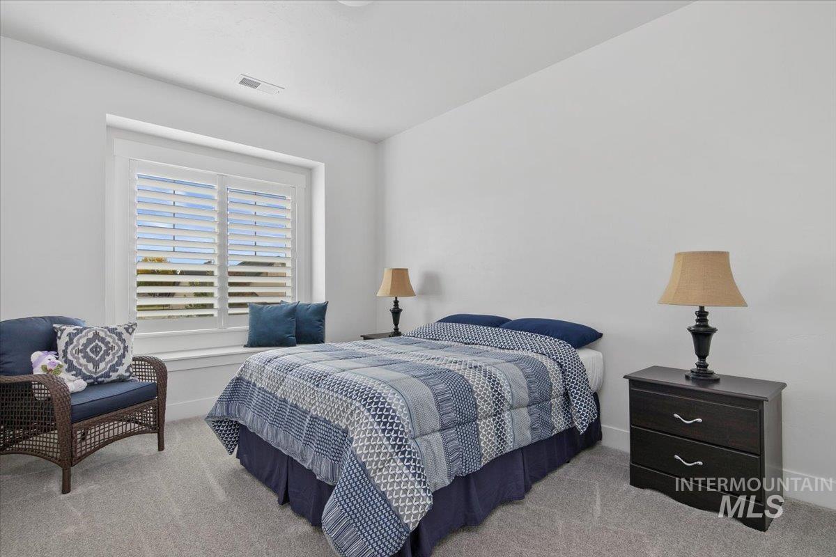 Bedroom with carpet and baseboards