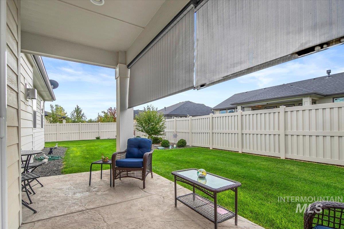 Fenced backyard featuring a patio area
