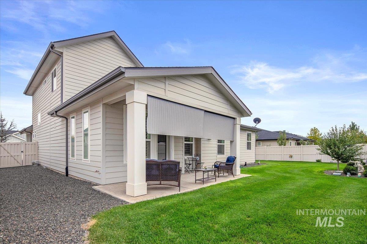 Rear view of property with a patio