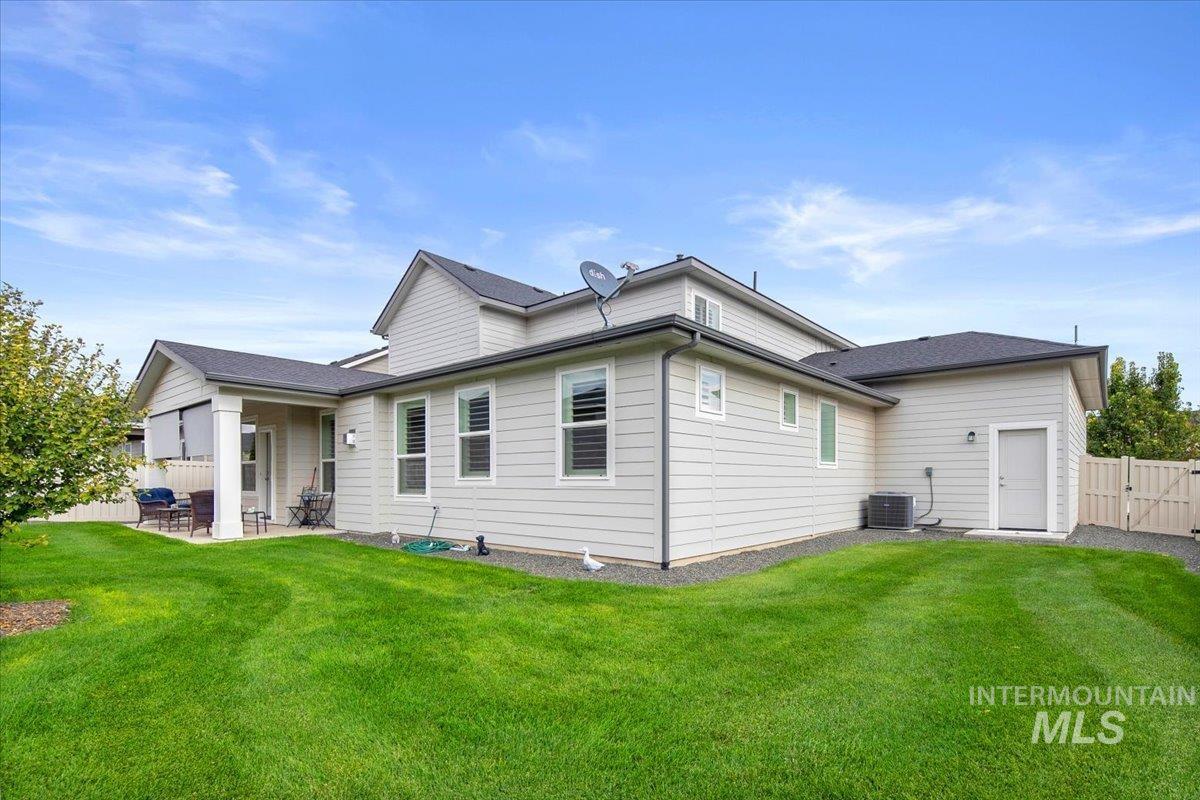 Back of house with a patio area