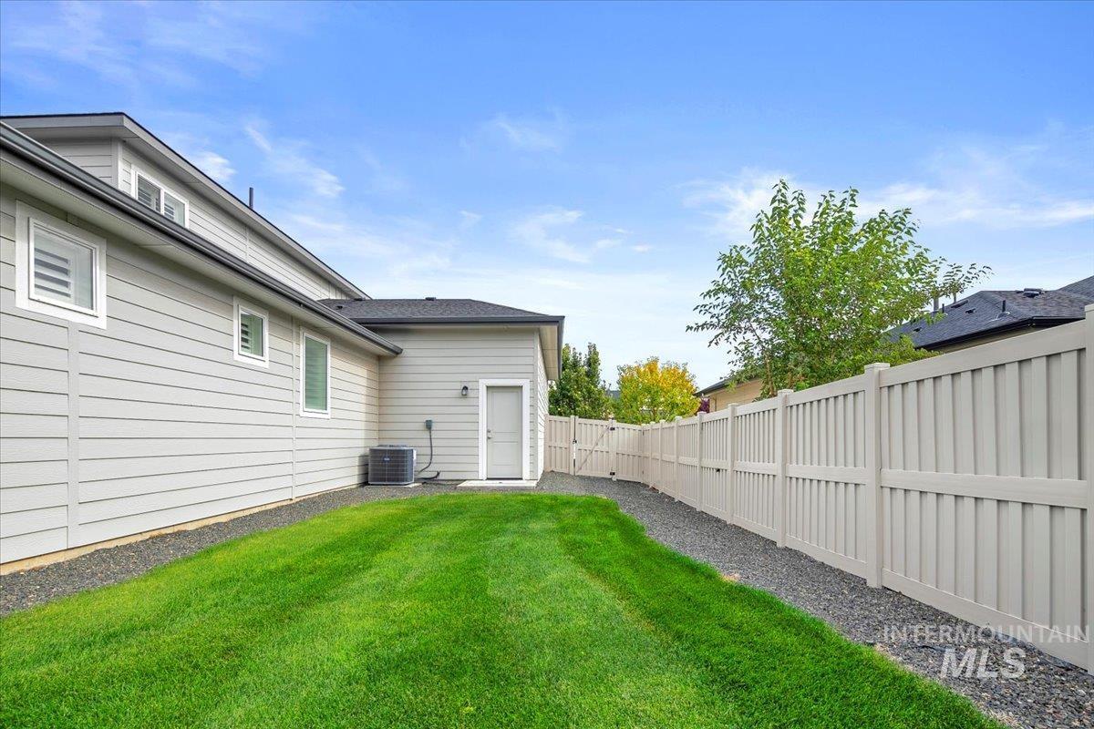 View of fenced backyard