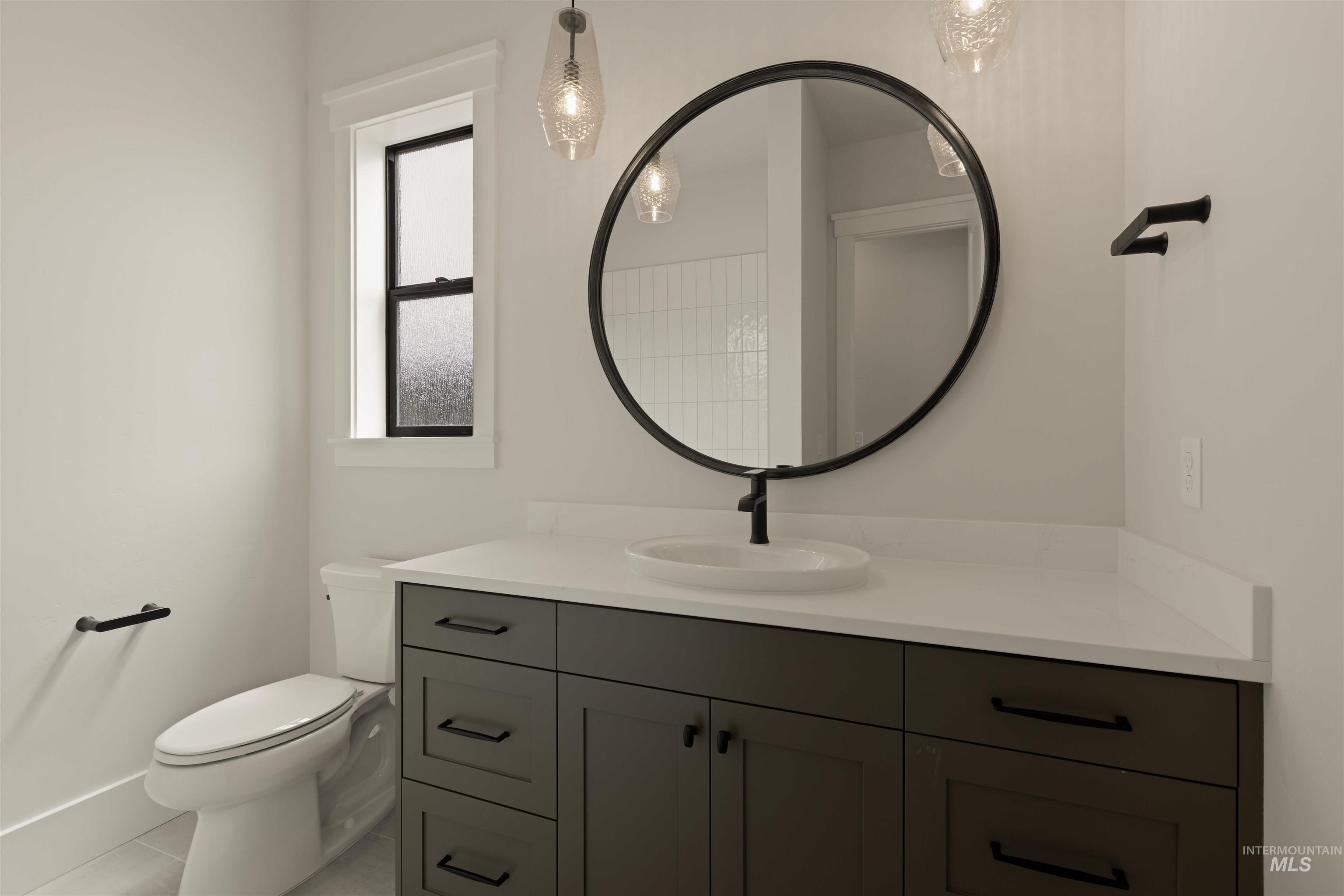 Bathroom with vanity and tile patterned floors