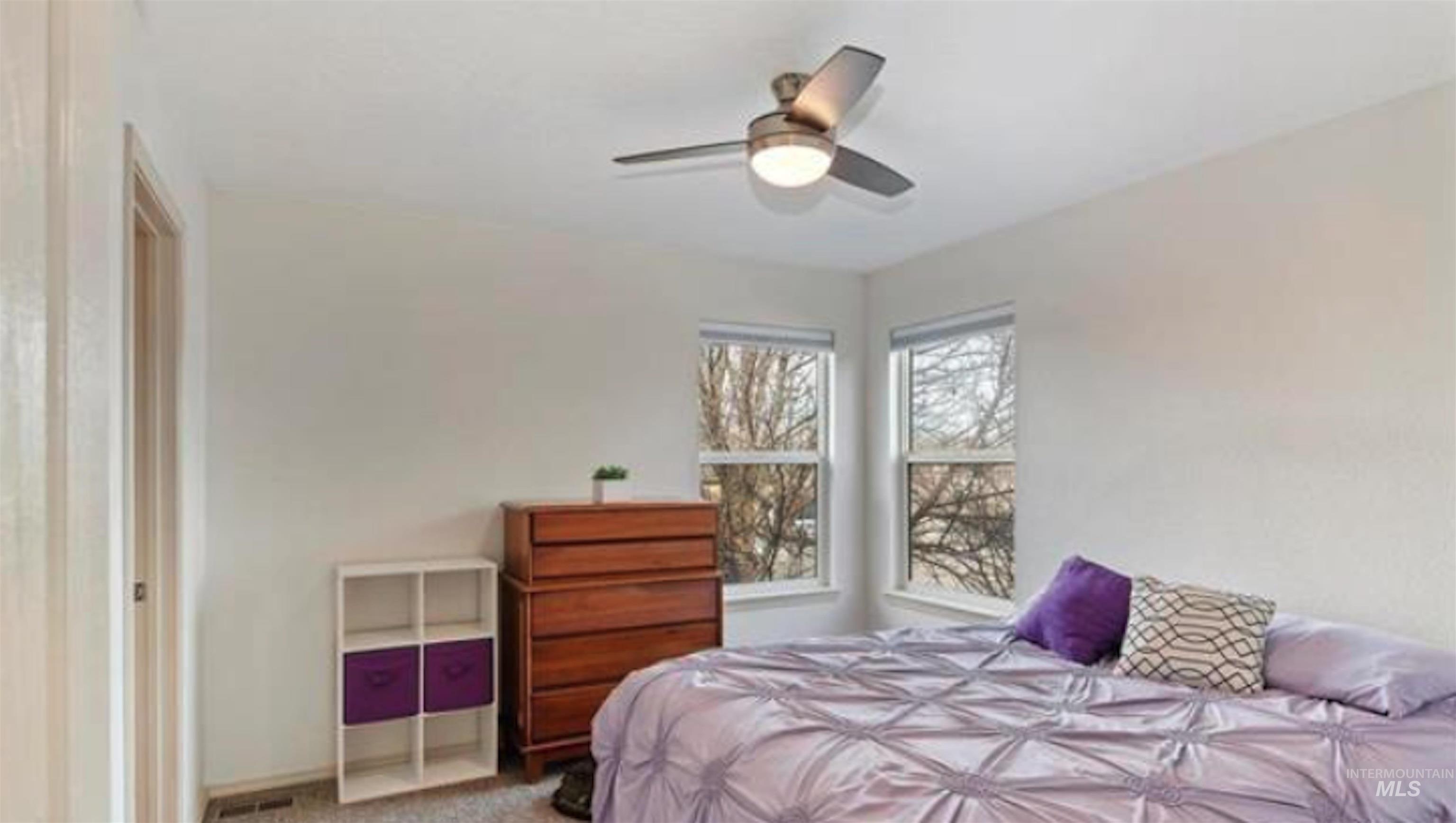 Bedroom with carpet flooring and ceiling fan