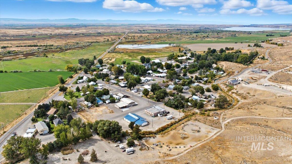Aerial view of property's location with a water and mountain view and rural landscape