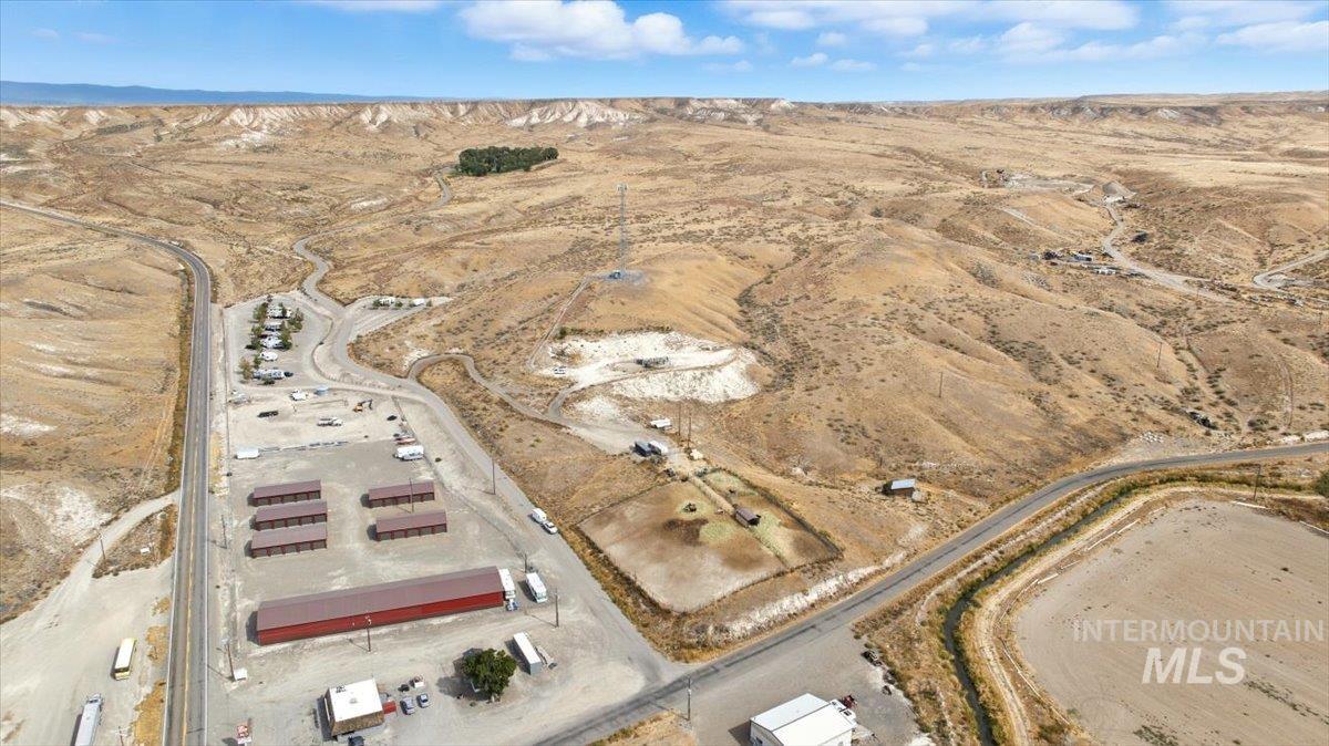 Aerial view of property and surrounding area with a desert landscape and rural landscape