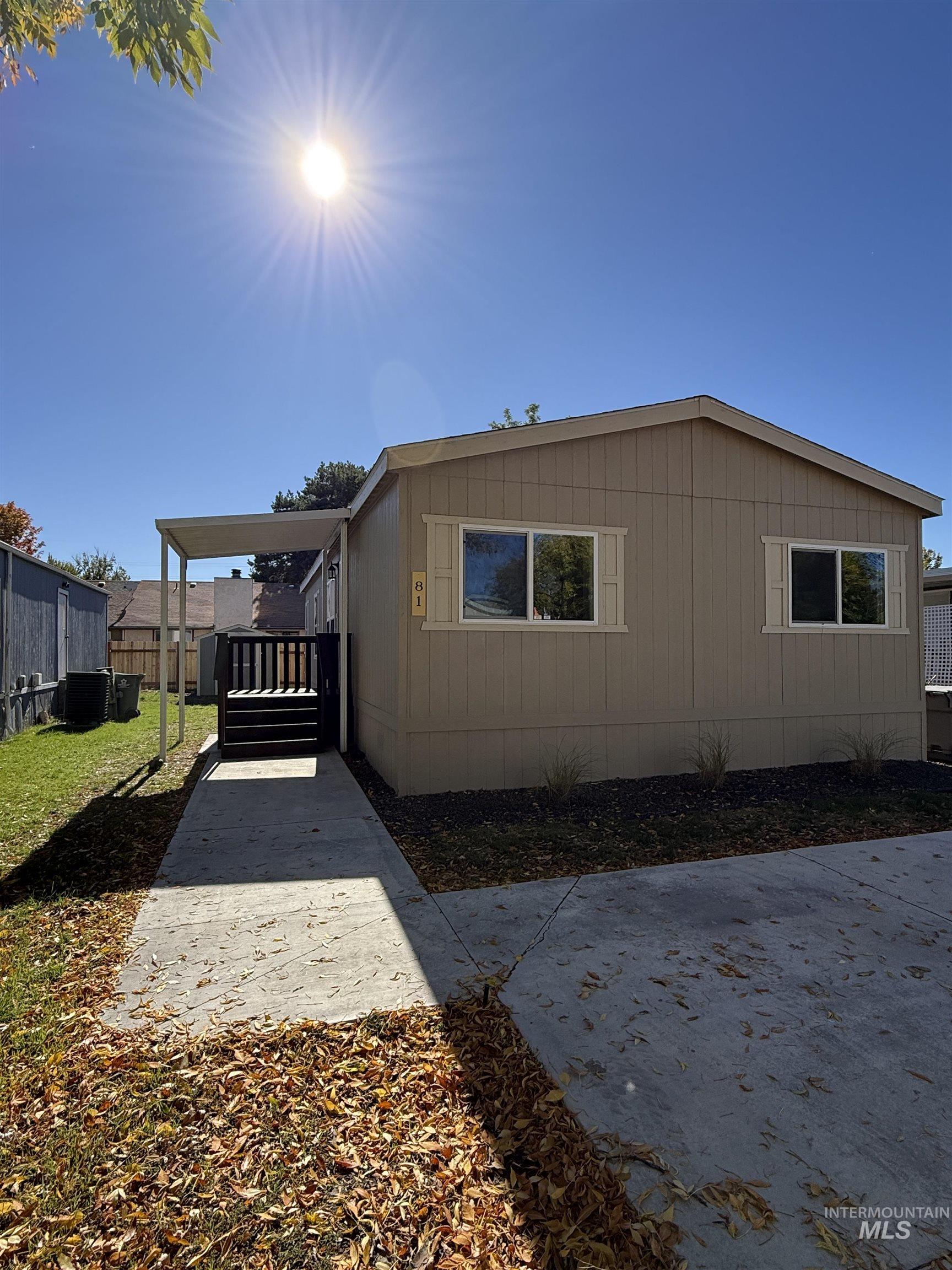 View of side of property with a deck
