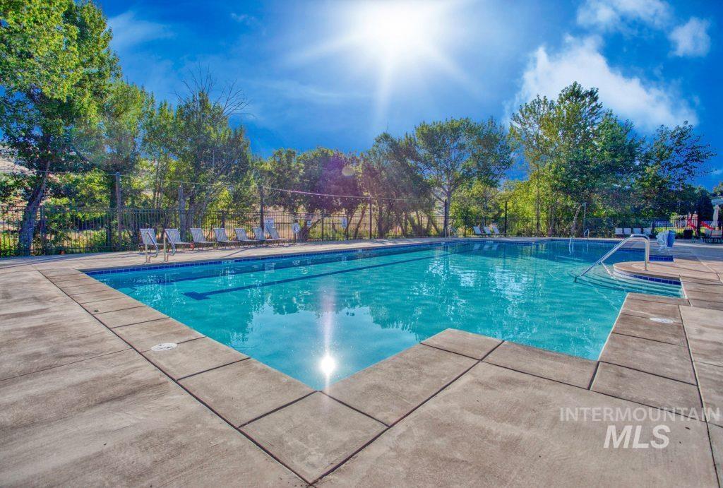 Community pool featuring a patio area