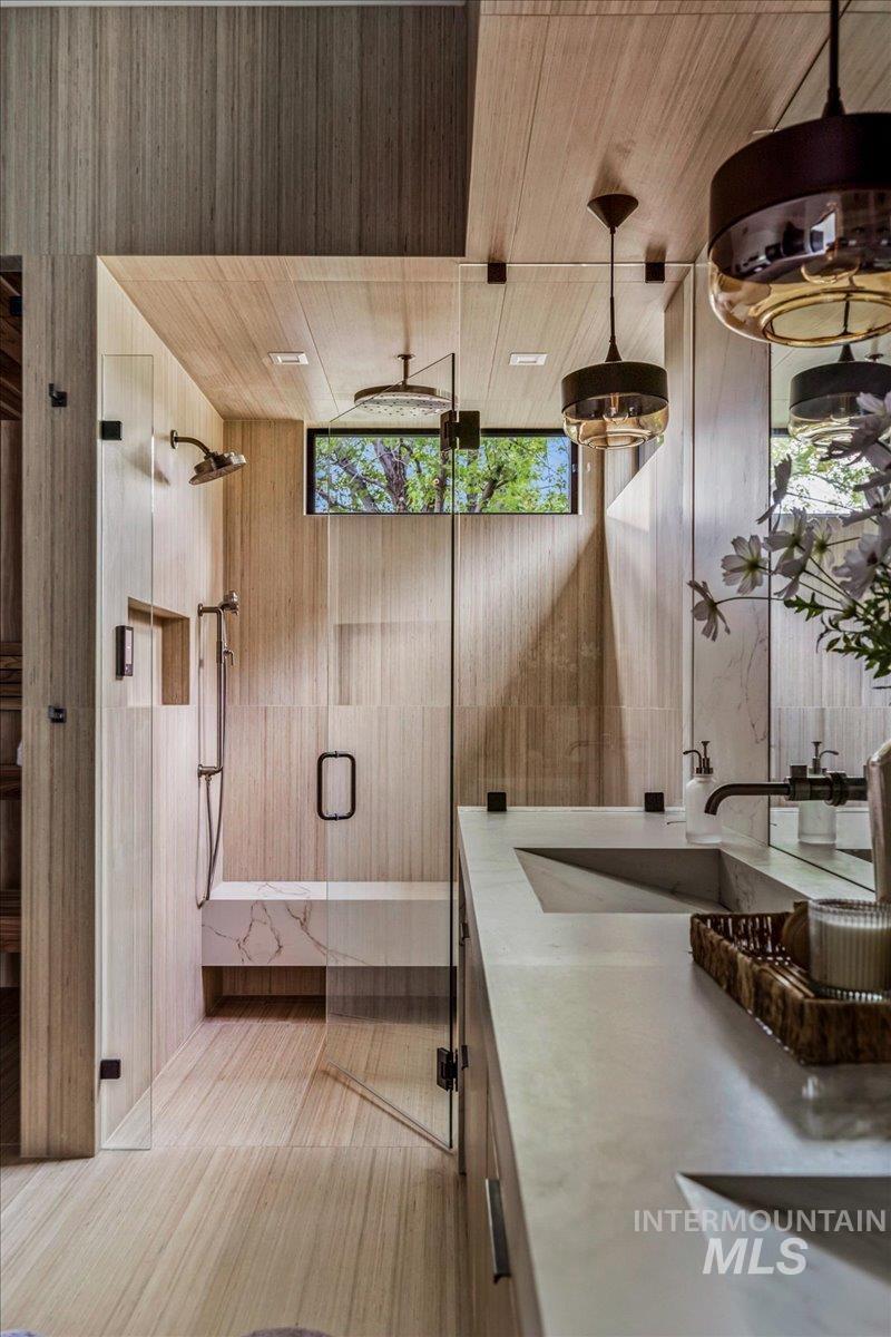 Bathroom with a stall shower and vanity