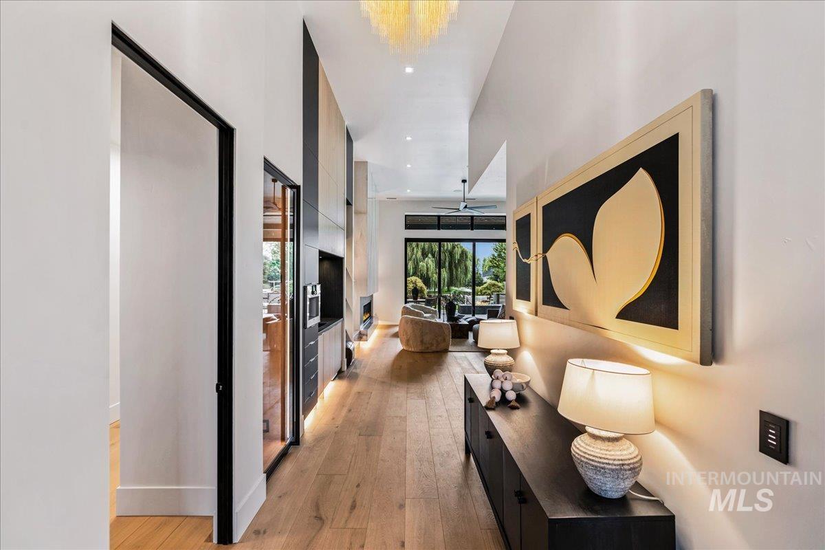 Hallway with light wood-style floors