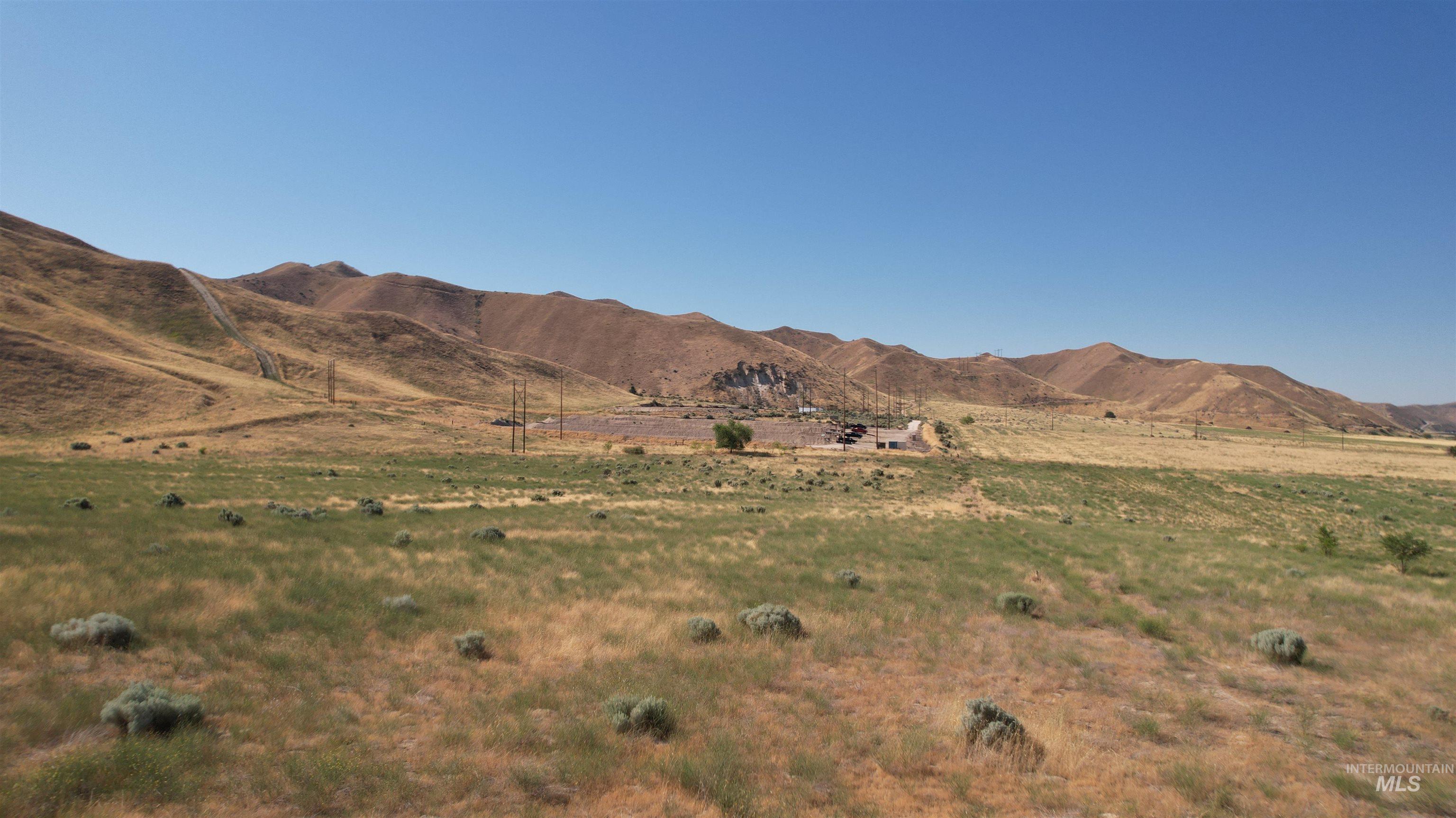 View of mountain background featuring rural landscape