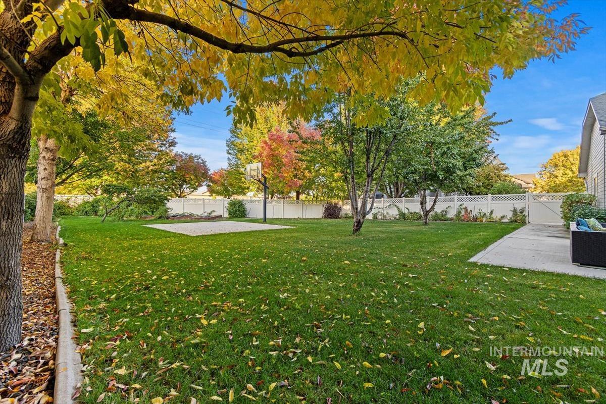 Fenced backyard with a patio