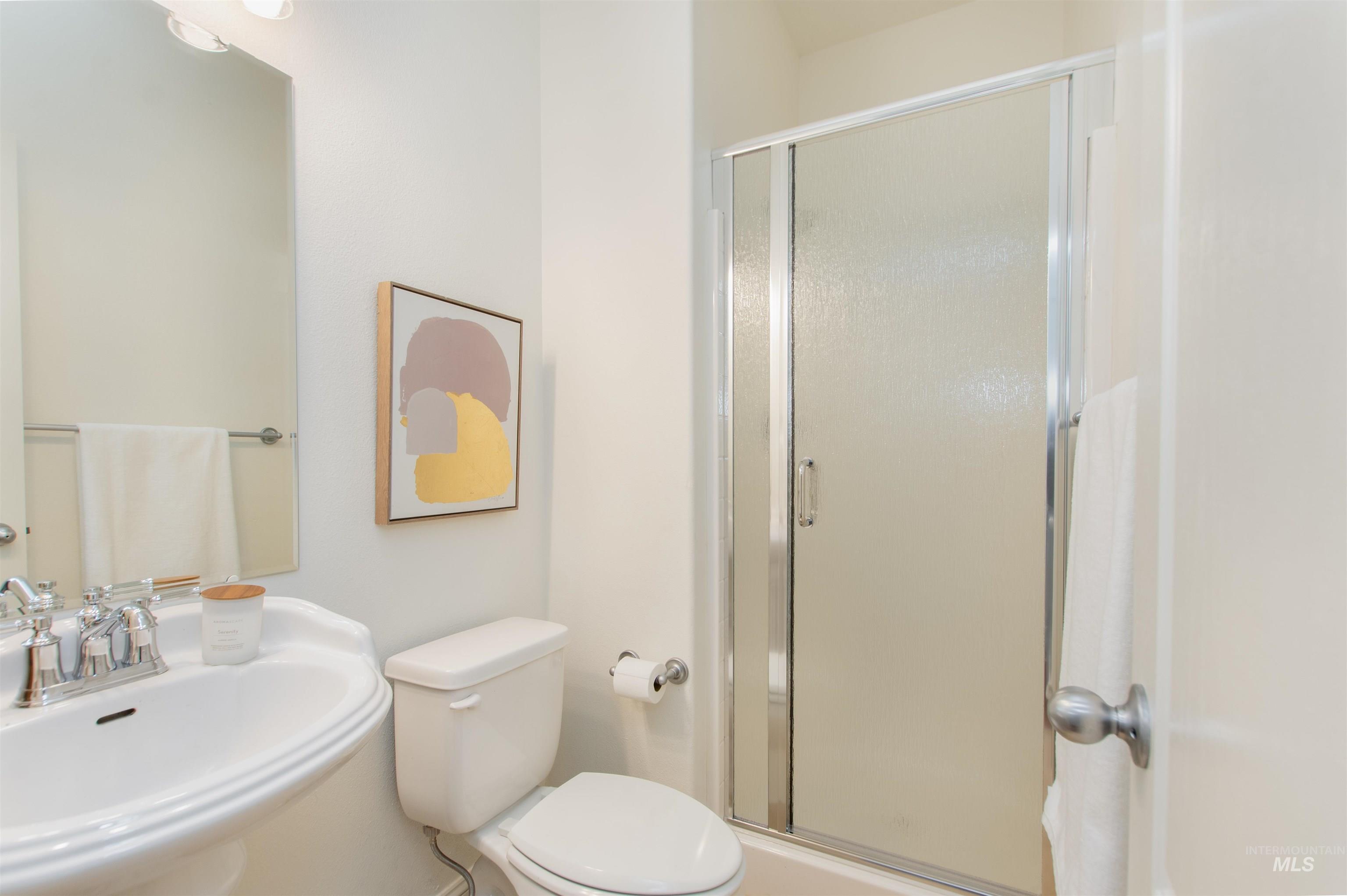 Bathroom featuring a shower stall
