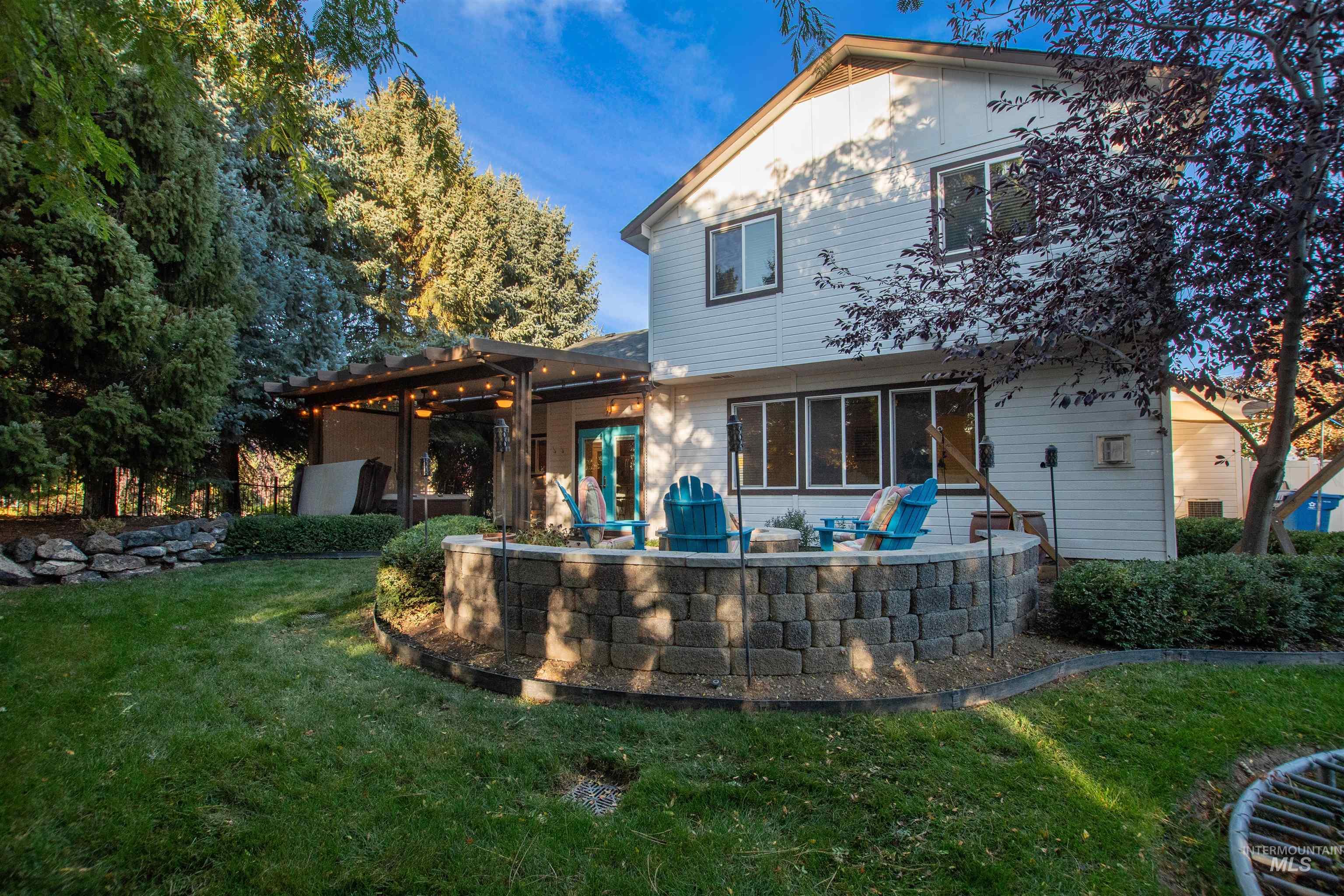 Back of property featuring a yard and a patio area